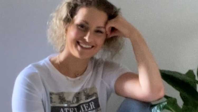Fran, a young woman with curly dark blond hair, wears her FTBC shirt